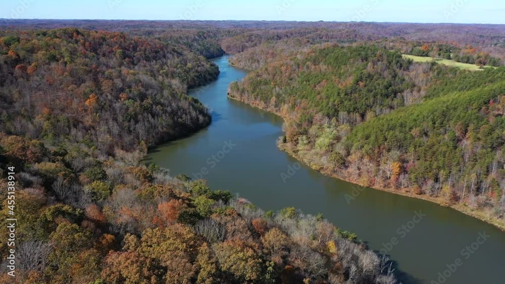 fall colors surrounding lake with drone fall colors surrounding lake with drone