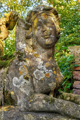 Detail of an old weathered sphinx sculpture. Itlingen Castle, North Rhine-Westphalia, Germany photo