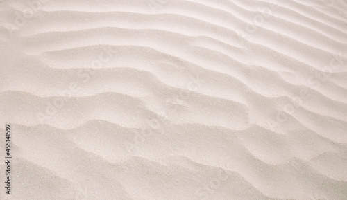 Abstract background of sandy sea on the beach. Wave sand texture photo