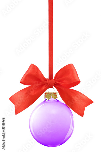Purple transparent glass Christmas bauble hanging on a red satin ribbon with a bow, isolated on white..
