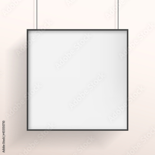 White poster or bilboard with black frame hanging on white wall