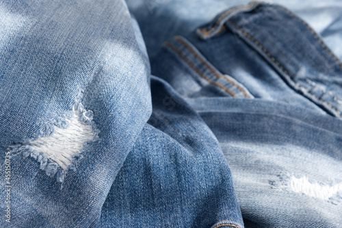 background of blue crumpled ripped jeans. Close up  (ID: 455150735)