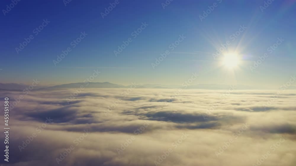 Wonderful view of extraordinary cloudy valley and bright orange sunset Wonderful view of extraordinary cloudy valley and bright orange sunset