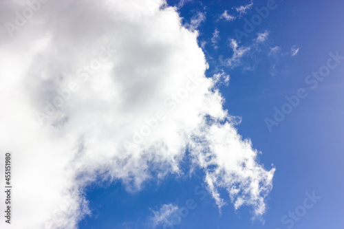 Blue sky with clouds. White cloud. Sunlight.