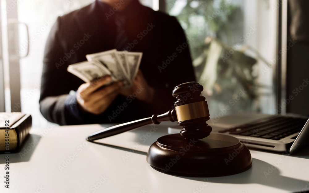 justice and law concept.Male judge in a courtroom on wooden table and Counselor or Male lawyer working in office. Legal law, advice and justice concept. justice and law concept.Male judge in a courtroom on wooden table and Counselor or Male lawyer working in office. Legal law, advice and justice concept.