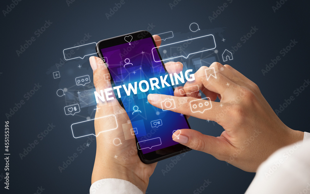 Hand using smartphone with social media concept