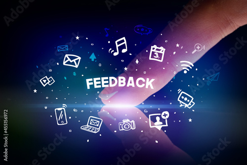 Finger touching tablet with social media icons concept