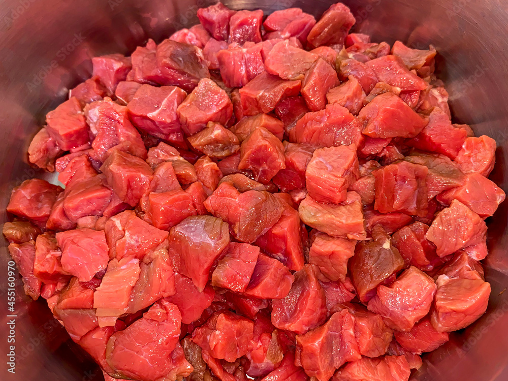 Meat cut into morsel sized pieces in the pot Meat cut into morsel sized pieces in the pot