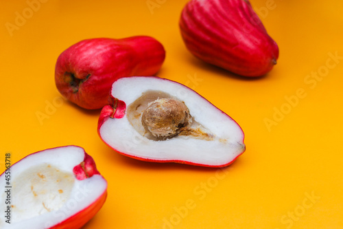 Jambu Bol or Jambu Jamaica isolated on orange background also known as Malay red rose Apple (Syzygium Malaccense).