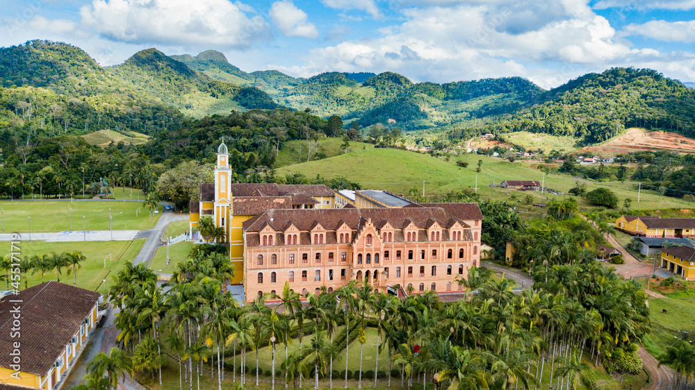 Mosteiro de Corupá, SC - Beautiful architecture of the monastery with the surrounding nature and mountains in the background