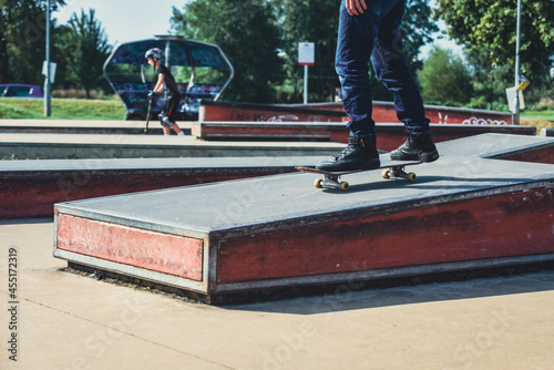 a skateboarder in action doing tricks on ramps at a skate park