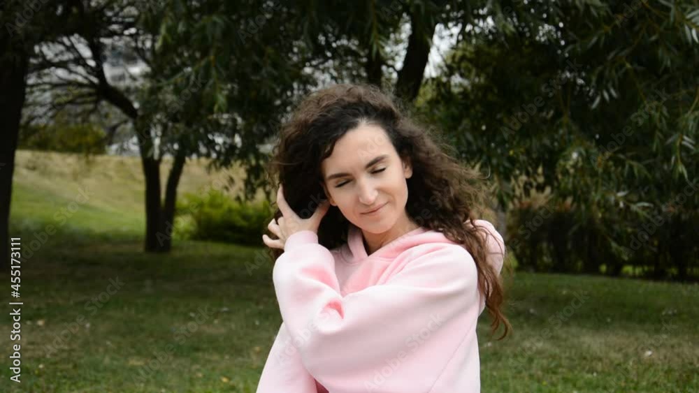Beautiful curly girl portrait in the park Beautiful curly girl portrait in the park