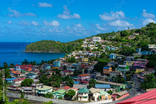Small fishing village on St Lucia. Caribbean colored houses and bay.