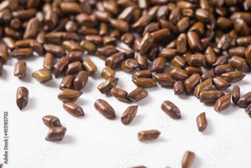 Chinese herbal medicine cassia seeds on white background