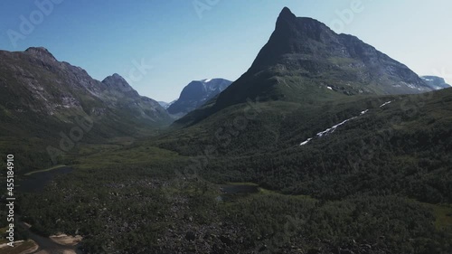 Scenic View Of Pointy Mountain And Lake In Innerdalen Valley, Norway - aerial drone shot photo