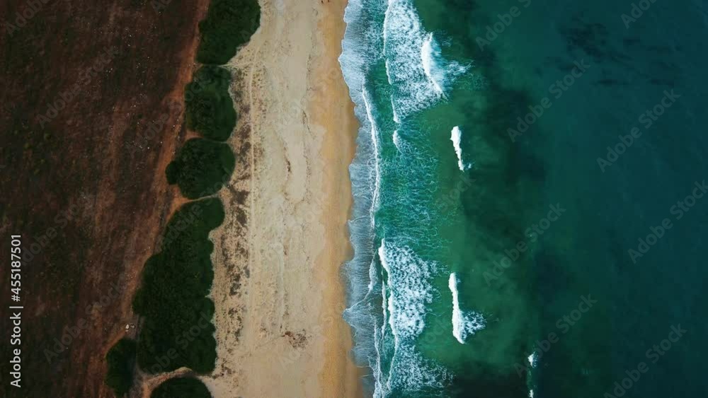Cinemagraph seamless video loop seaside island Sardinia in Italy. Bird view aerial drone air view flight above a natural tourist vacation sea coast sand beach sandy bay with clear blue water. Cinemagraph seamless video loop seaside island Sardinia in Italy. Bird view aerial drone air view flight above a natural tourist vacation sea coast sand beach sandy bay with clear blue water.