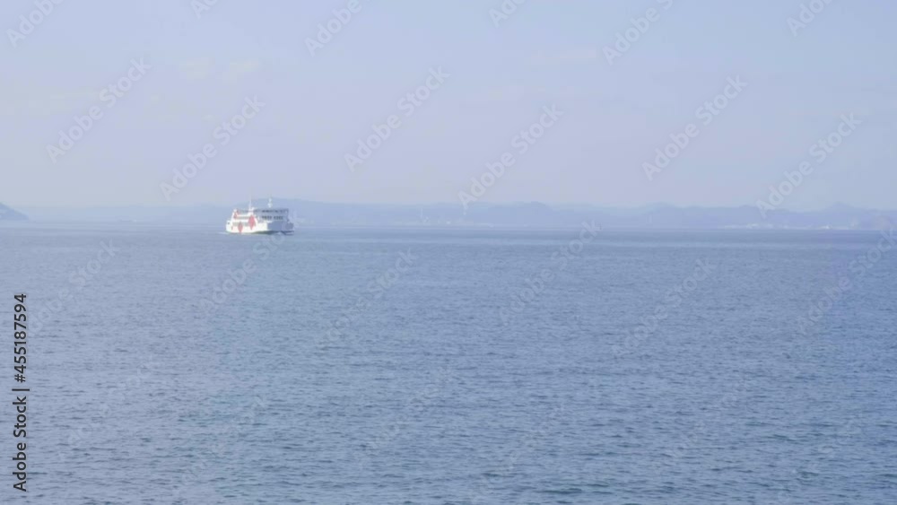 Ferry on a distance in the sea. Ferry on a distance in the sea.