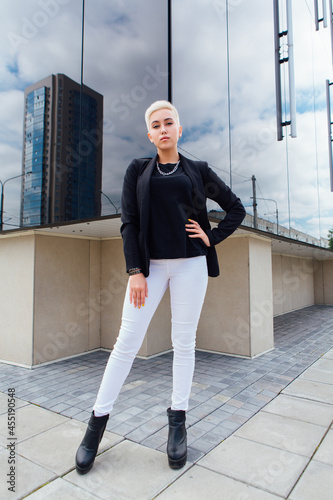 Young stylish business woman with short hair and nose piercing