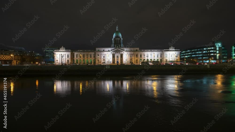 Time lapse of Custom House historical building in Dublin City at night with reflection on Liffey river in Ireland. Time lapse of Custom House historical building in Dublin City at night with reflection on Liffey river in Ireland.
