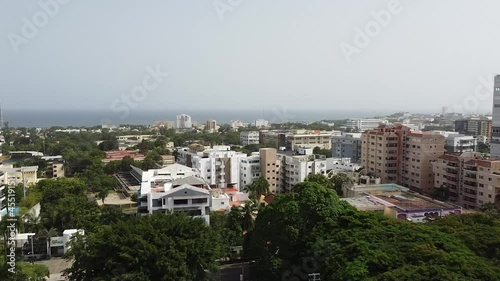 Aerial view of the iberoamerican park with the background of the city with high rise residential apartments, beautiful sunny day photo