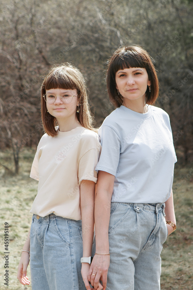 two happy girls smiling. Portrait of women hugging. The concept of relationships in the family, friends, sisters, couple in love two happy girls smiling. Portrait of women hugging. The concept of relationships in the family, friends, sisters, couple in love