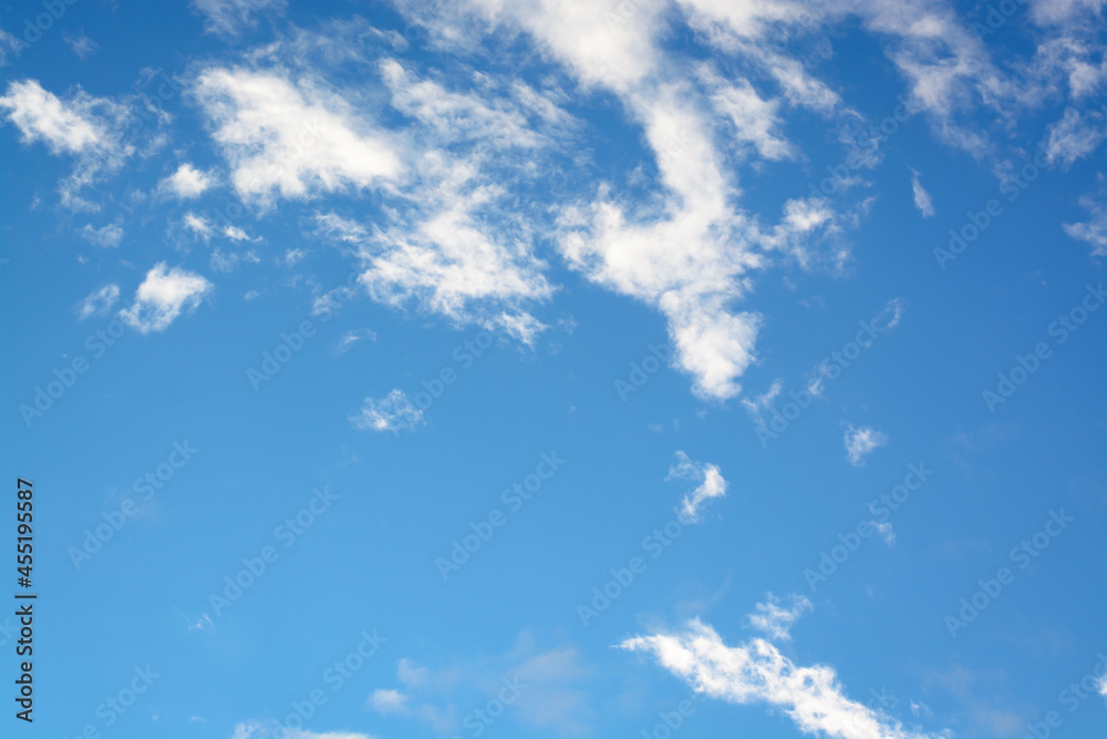Horizontal view with white small clouds against blue sky Horizontal view with white small clouds against blue sky