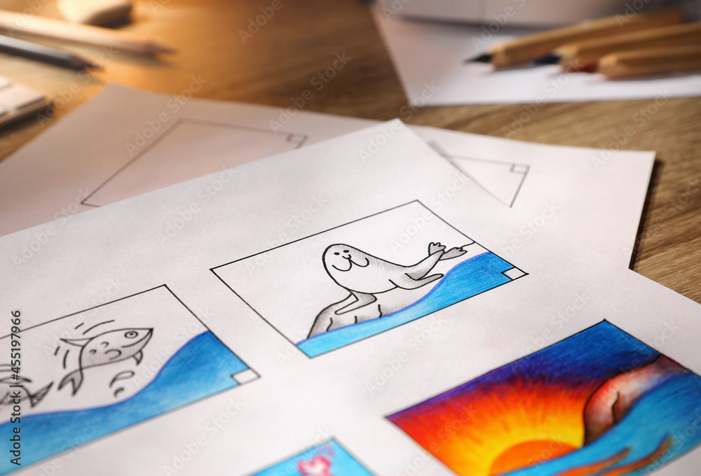 Storyboard with cartoon sketches at workplace, closeup. Pre-production process Storyboard with cartoon sketches at workplace, closeup. Pre-production process