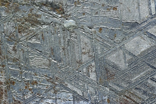 The surface of the Muonionalusta meteorite etched in acid with the Widmanstetten patterns