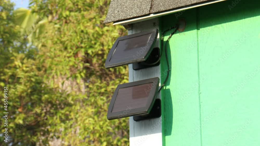 Clean Mini Solar Panels Mounted on the Corner of House Clean Mini Solar Panels Mounted on the Corner of House