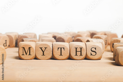 Myths word cube on wood background 