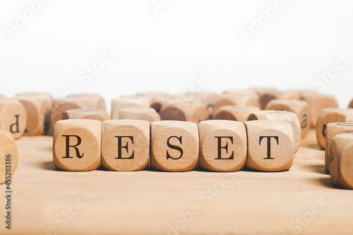 Reset word cube on wood background 