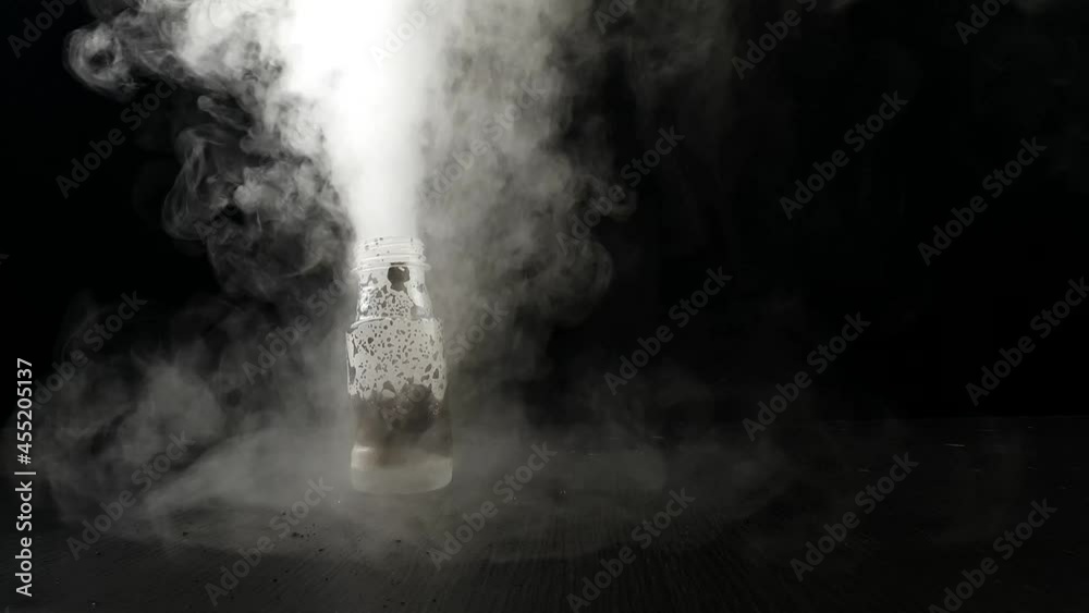 Potassium Permanganate Hydrogen Peroxide Decomposition Reaction. Smoke effect from the chemical reaction of mixing KMno4 and H2O2. Dangerous experiment on black background