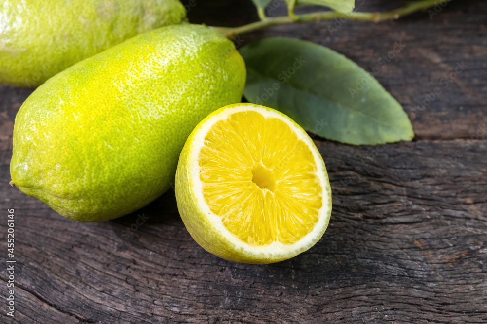 Fresh lemon on an old wooden table. Fresh lemon on an old wooden table.