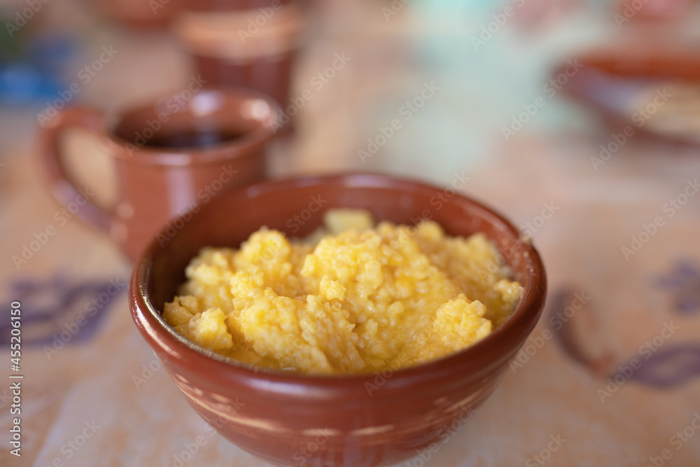 Pumpkin millet porridge in a bowl on the table Pumpkin millet porridge in a bowl on the table