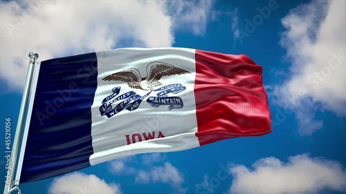 Iowa Flag with texture and reflections waving in blue sky with clouds   photo