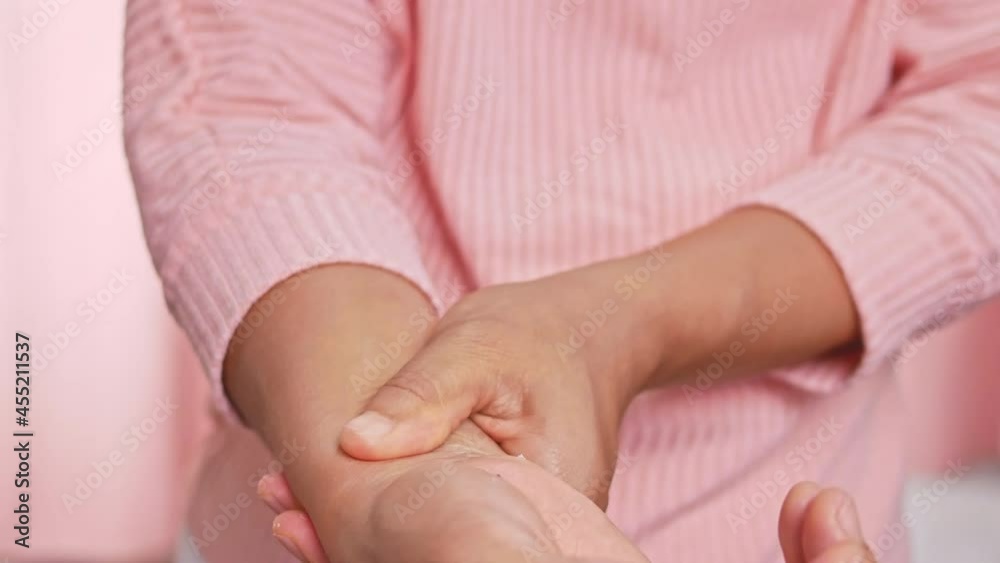 Closeup of female holding her painful wrist caused by prolonged work on the computer or housewife, Carpal tunnel syndrome, arthritis. Neurological disease concept. Closeup of female holding her painful wrist caused by prolonged work on the computer or housewife, Carpal tunnel syndrome, arthritis. Neurological disease concept.