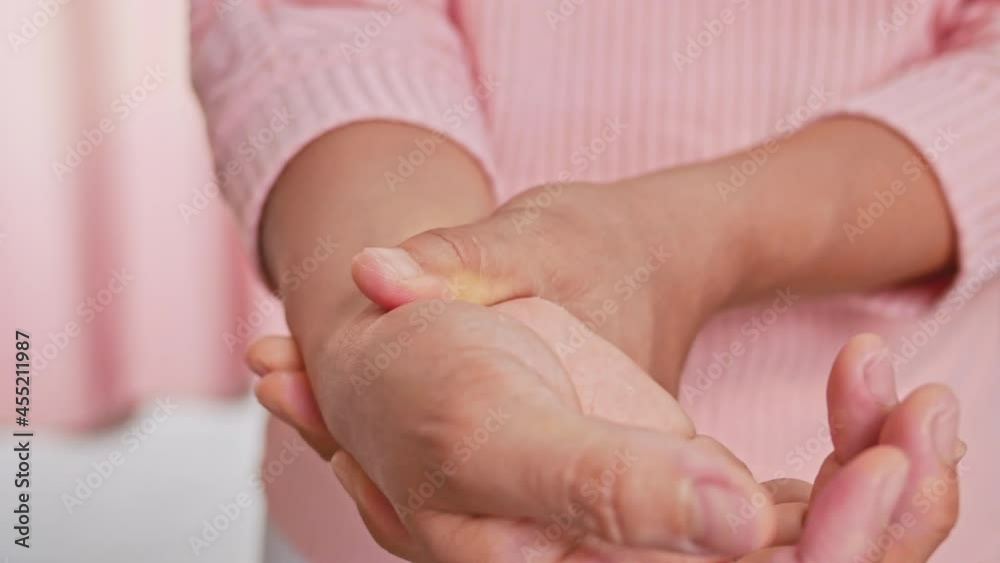 Closeup of female holding her painful wrist caused by prolonged work on the computer or housewife, Carpal tunnel syndrome, arthritis. Neurological disease concept. Closeup of female holding her painful wrist caused by prolonged work on the computer or housewife, Carpal tunnel syndrome, arthritis. Neurological disease concept.