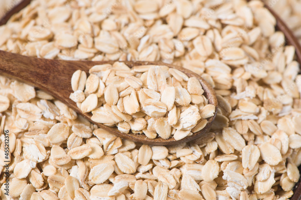oat flakes or oatmeal in a spoon oat flakes or oatmeal in a spoon