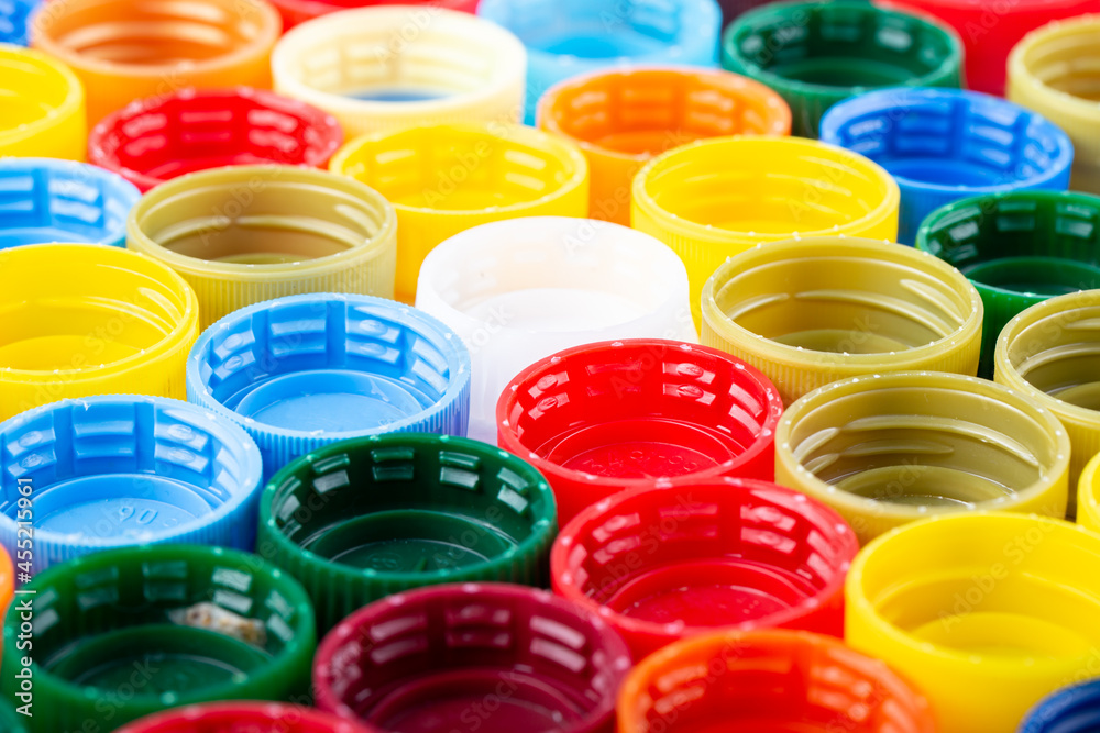 Plastic bottle caps background. Cap material is recyclable. Plastic bottle caps background. Cap material is recyclable.