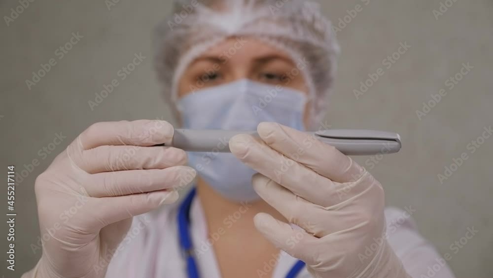 A closeup of a doctor in medical gloves shows a patient with diabetes