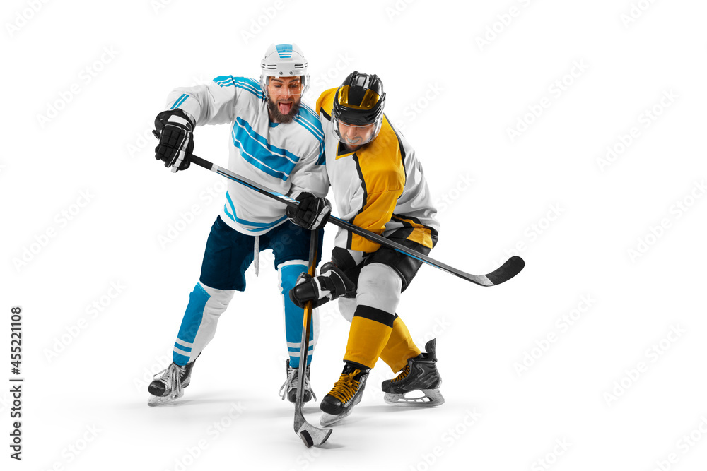 Obraz premium Hockey concept. Two professional hockey players riding on ice. Fight for the puck. Isolated on a white. Sports emotions