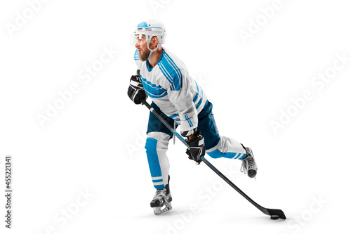 Professional hockey player in the helmet and gloves on white background. Side view. Sport concept. Athlete in action