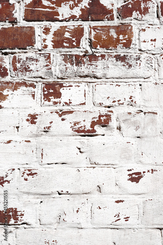 Brick wall background. Old painted bricks close up. © Oksana