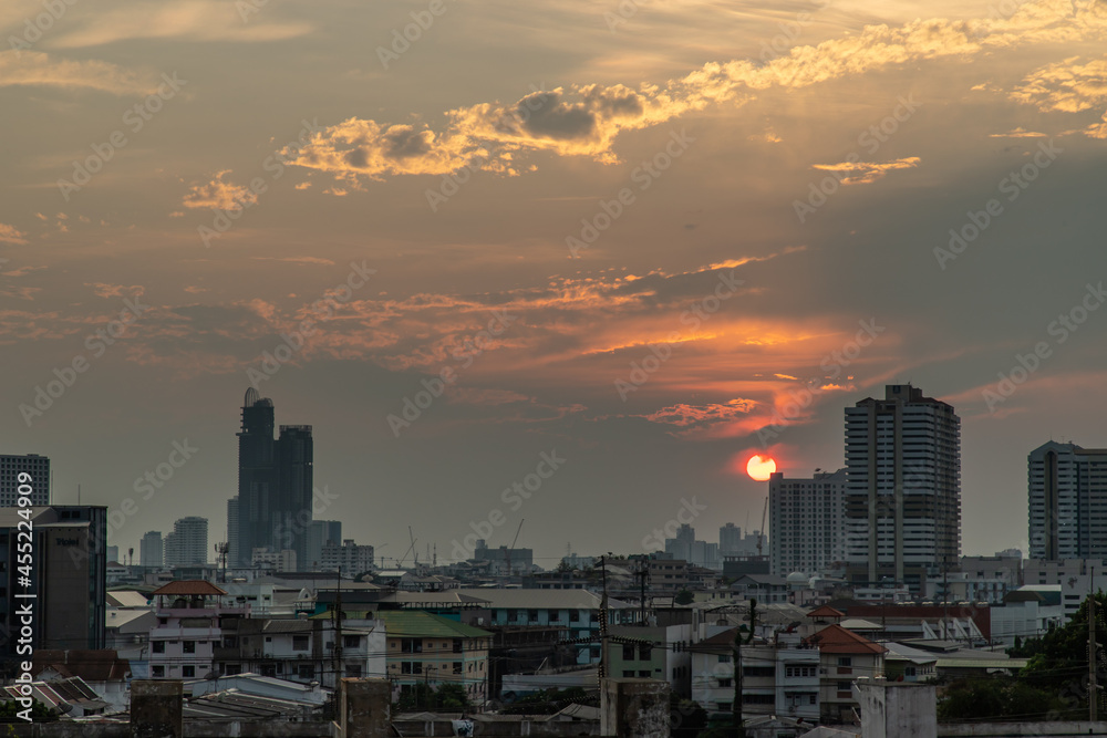 Bangkok, Thailand - 09 Apr, 2020 : Skyscrapers Bangkok City in the light of the setting sun silhouetted cities at sunset. Beautiful sunset over office building center. Selective focus.