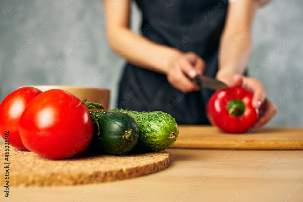 Cook woman on the kitchen cutting vegetables salad diet Cook woman on the kitchen cutting vegetables salad diet