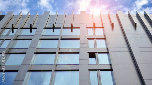 Fragment of glass and metal facade walls. Commercial office buildings. Abstract modern business architecture.