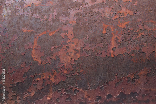 old rusted metal plate with chipped paint