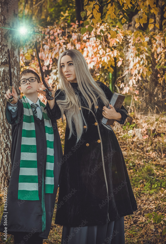 Halloween party ideas, people outfit. Woman and boy from school of wizards and magic Halloween party ideas, people outfit. Woman and boy from school of wizards and magic