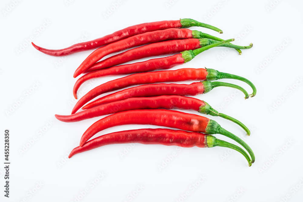 Fresh red peppers on white background Fresh red peppers on white background