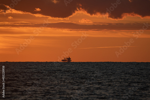 Fotografi Fata morgana in sunset time on Baltic sea.